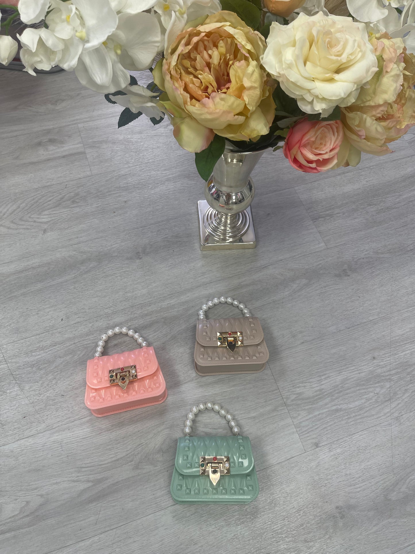 Little bags with coloured gem buckle